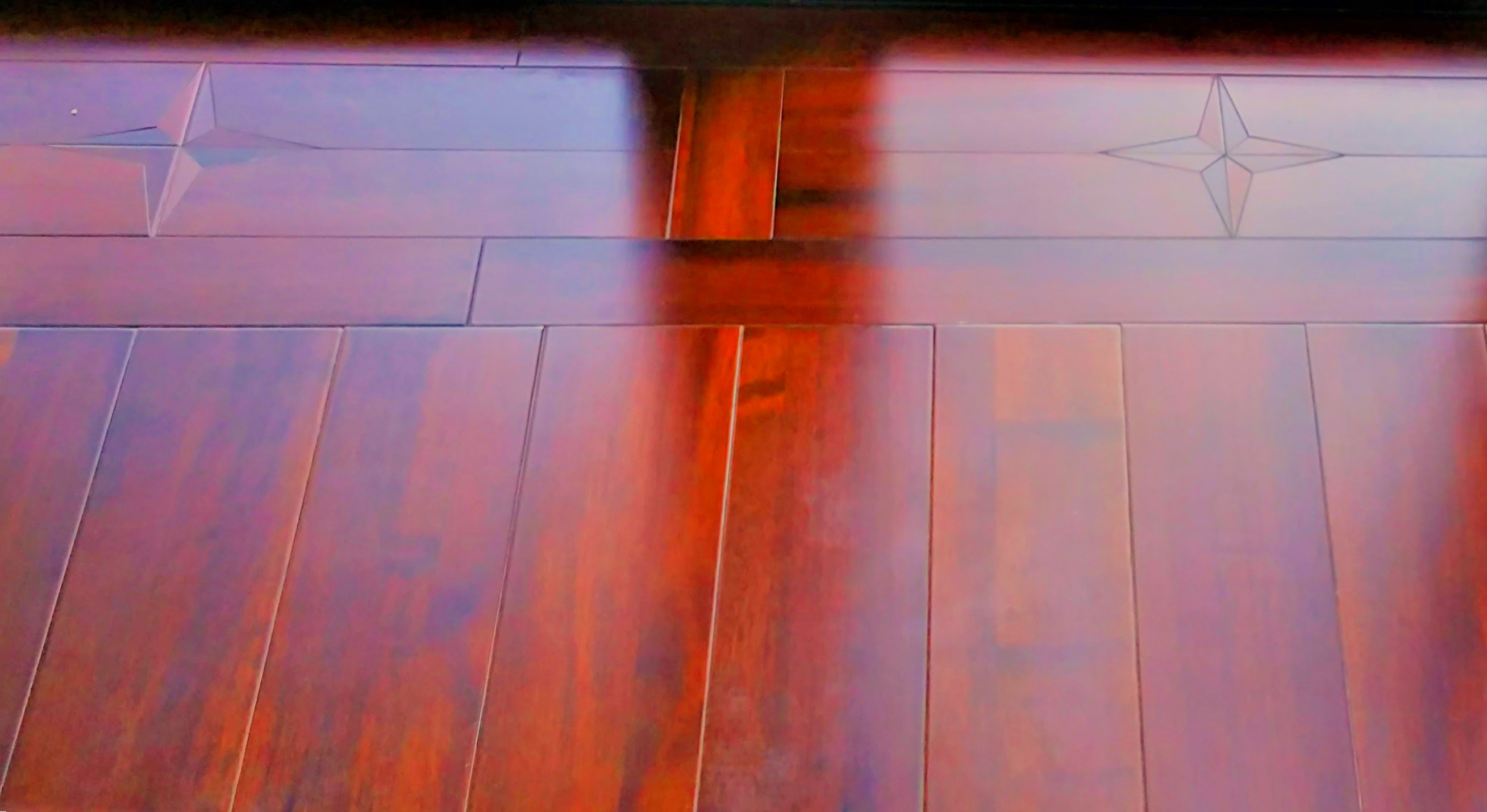 Bespoke timber star inlay detailing set in flooring